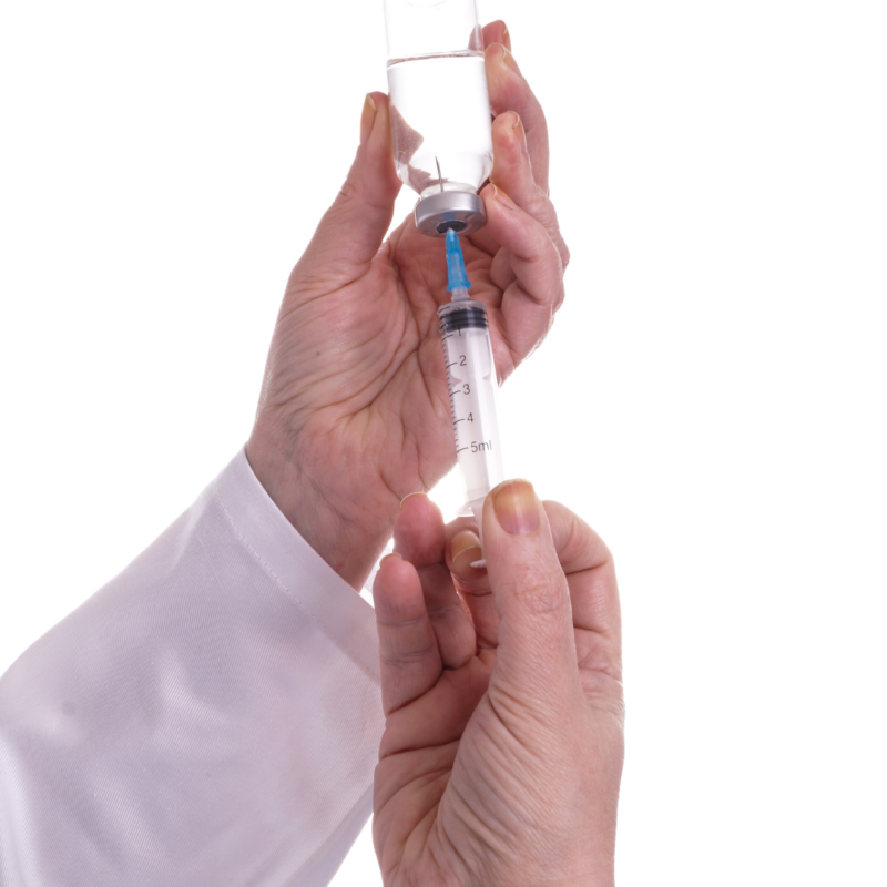 man drawing up semaglutide and tirzepatide into a syringe from a vial