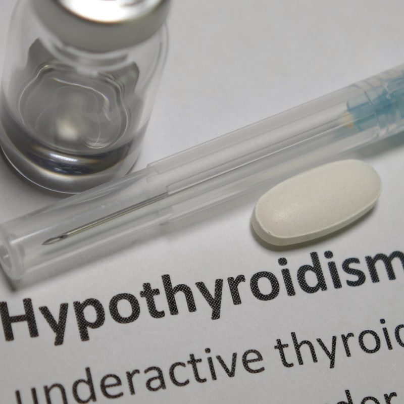 picture of the word hypothyroidism next to a vial and syringe